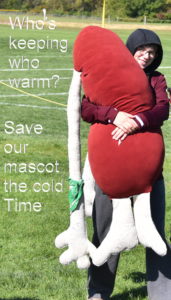 Tim and mascot keeping warm